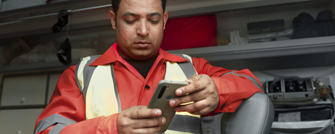 medium-shot-man-holding-smartphone